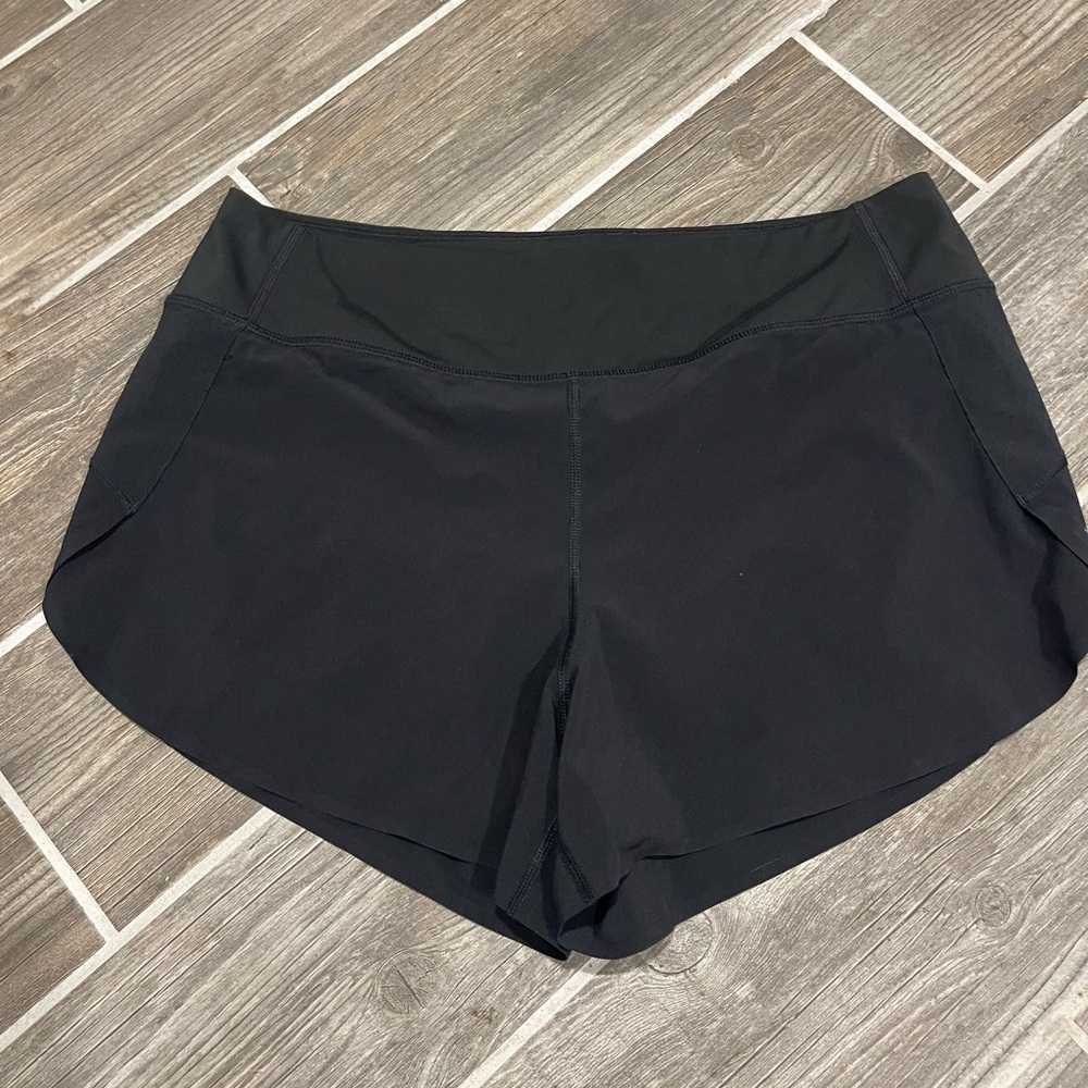 Athleta Black Athletic Shorts with Curved Hem and Moisture-Wicking Fabric